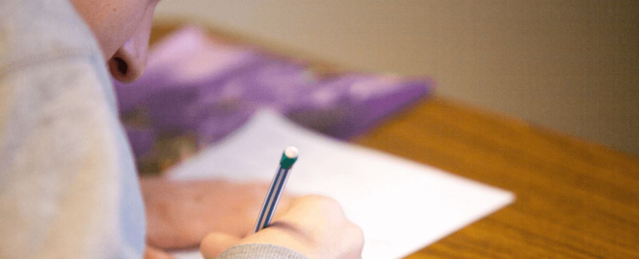Person writing on paper